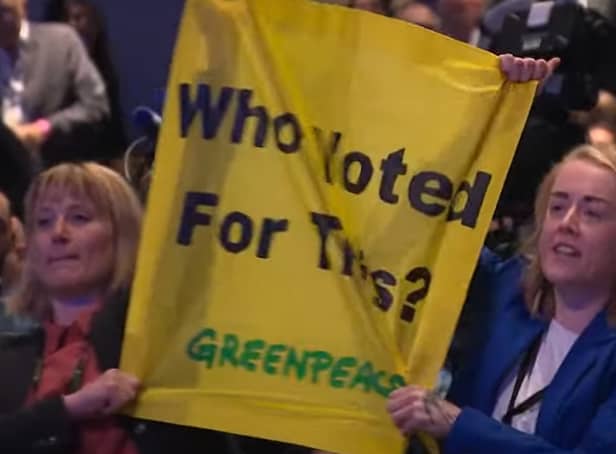 Protestors heckle Prime Minister Liz Truss during her keynote speech at the Conservative Party Conference 2022 in Birmingham.