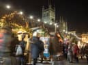 Christmas shoppers browse stalls at the traditional Christmas market in Bath.