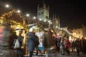 Christmas shoppers browse stalls at the traditional Christmas market in Bath.