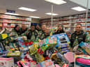 Reese, far right, and his team with some of hundreds of toys they bough from Smyth's Toy Shop