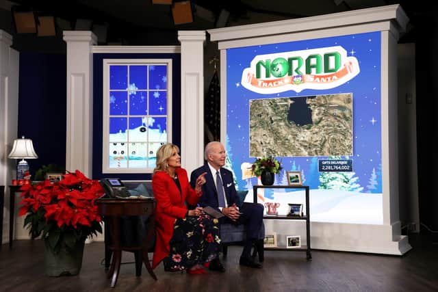 U.S. President Joe Biden and first lady Dr. Jill Biden participate in an event to call NORAD and track the path of Santa Claus on Christmas Eve