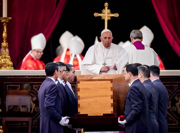 <p>Pope Francis attends the funeral mass for Pope Emeritus Benedict XVI as pallbearers carry the coffin at the end of the funeral mass at St. Peter's square</p>