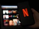 In this photo illustration a computer and a mobile phone screens display the Netflix logo on March 31, 2020 in Arlington, Virginia. (Photo by Olivier DOULIERY / AFP) (Photo by OLIVIER DOULIERY/AFP via Getty Images)