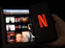 In this photo illustration a computer and a mobile phone screens display the Netflix logo on March 31, 2020 in Arlington, Virginia. (Photo by Olivier DOULIERY / AFP) (Photo by OLIVIER DOULIERY/AFP via Getty Images)