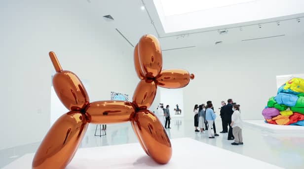 A woman accidentally destroyed a Jeff Koons glass sculpture believing it to be a balloon dog.
