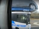 Police officers overtaking a heavily-laden car transporter were shocked to discover the driver was using just one elbow to control the huge vehicle as he travelled along a busy motorway. 