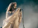 Riley Keough as Daisy Jones in Daisy Jones & The Six, performing in a style reminiscent of Stevie Nicks (Credit: Lacey Terrell/Prime Video)