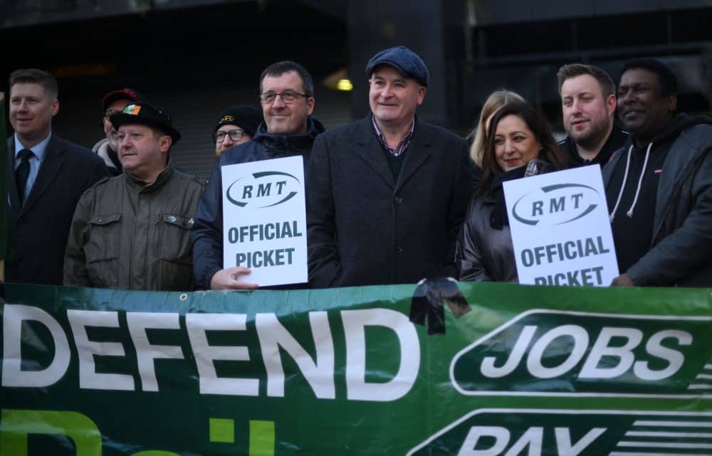 RMT general secretary Mick Lynch (centre) on an RMT picket line during January’s strike (Photo by DANIEL LEAL/AFP via Getty Images)