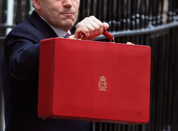 <p>The red briefcase being held by chancellor Gordon Brown in 2007 (Photo: Getty) </p>
