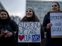 NHS physiotherapists take part in a strike outside of St Thomas’ Hospital on January. (Photo by Carl Court/Getty Images)