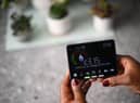 Samantha Pierre-Joseph shows her smart meter indicating how many kWh (kilowatt-hour) she has used already in one day, and how much it has cost her, in her house in London, on December 13, 2022. 
