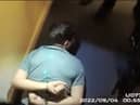 Thomas Cashman is arrested by armed police.