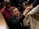 Olympic athlete Oscar Pistorius holds the hand of a relative after sentencing at the High Court on July 6, 2016 at the High Court in Pretoria, South Africa. Pistorius was sentenced to six years in prison for the murder of girlfriend Reeva Steenkamp at their home in 2013.