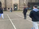 The cricketers passing the time at Dover with an impromptu match (Photo: SWNS)