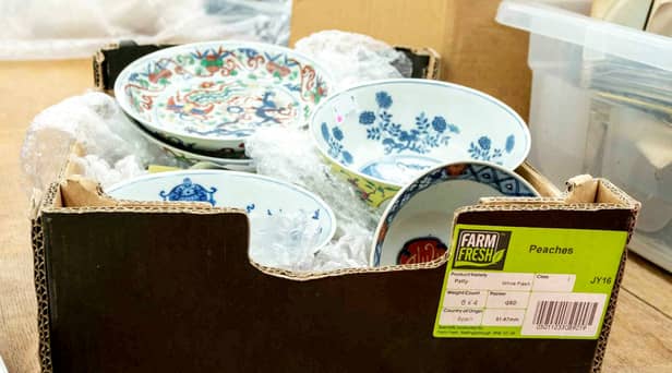The cardboard box containing a collection of dishes including Chinese ceramics which sold for a total of £112,000.  