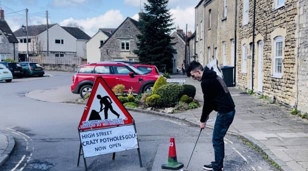 Ben Thornbury demonstrating 'crazy pothole golf' in Malmesbury