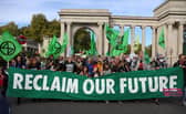Protesters march into central London at a demonstration by the climate change protest group Extinction Rebellion, on October 16, 2022. Credit: Isabel Infantes/AFP.
