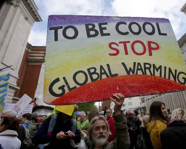 Scientists and science enthusiasts gather prior to the start of the 'March for Science' which celebrates the scientific method outside the Science Museum in central London on April 22, 2017, Earth Day