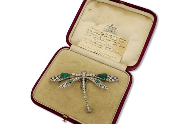 This emerald and diamond dragonfly brooch worn at three royal coronations has gone up for sale at Mayfair’s oldest family jewellers for £350,000.