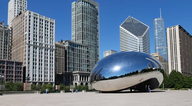 The Cloud Gate sculpture, popularly known as the bean, with Chicago's skyline
