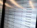 A screen shows cancelled flights at Milan Linate Airport in Milan, Italy on October 21, 2022 due to strike (Photo by Piero Cruciatti/Anadolu Agency via Getty Images)