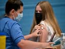 Teenager Eve Thomson receives a Covid-19 vaccination in Barrhead, Scotland (Photo: Jeff J Mitchell/Getty Images)