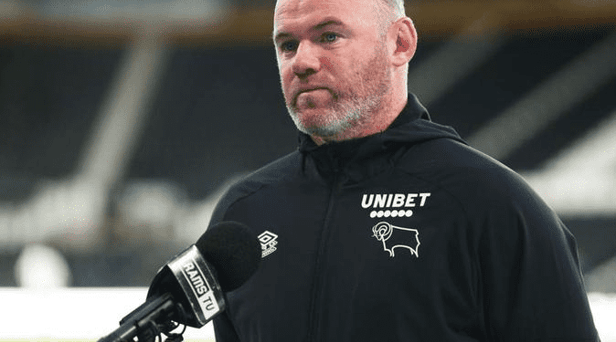 Wayne Rooney, manager of Derby County, is interviewed after the pre-season friendly match against Real Betis at Pride Park on July 28, 2021 in Derby, England. (Photo by Charlotte Tattersall/Getty Images)