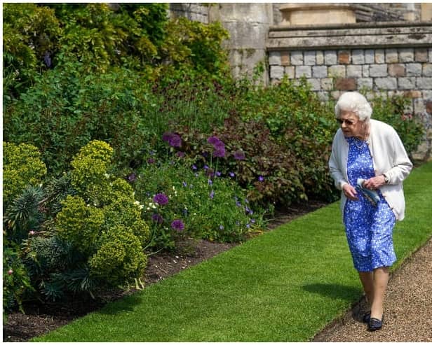 Queen Elizabeth II views a border in the gardens of Windsor Castle, where she received a Duke of Edinburgh rose, given to her by the Royal Horticultural Society (Photo by Steve Parsons - WPA Pool/Getty Images)