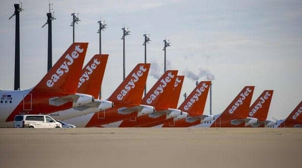Easyjet planes are seen parked at the "Berlin Brandenburg Airport Willy Brandt" in Schoenefeld, southeast of Berlin (Photo by ODD ANDERSEN/AFP via Getty Images)
