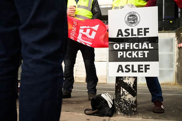 LONDON, ENGLAND - MAY 31: A group of rail workers stand on a picket line outside Euston rail station as a new round of strikes by train drivers begins on May 31, 2023 in London, England. Today's strike comes after the train drivers union, ASLEF, rejected a pay rise offer of 4 percent a year over two years from the Rail Delivery Group (RDG). (Photo by Leon Neal/Getty Images)