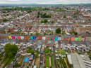 Tasha Frootko and partner Stuart Doust have transformed a street by painting the houses bright colours in Gloucester.