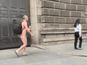 Kitted out in just a rucksack and flip flops while carrying a takeaway coffee, the commuter appeared to be grinning at fellow Londoners as he walked through the city naked.