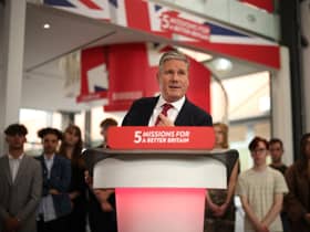 Sir Keir Starmer heckled on stage by green protesters who demand ‘no more U-turns’ from Labour leader 