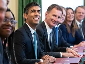Rishi Sunak and Jeremy Hunt are considering awarding pay rises to certain groups of striking workers. (Photo by STEFAN ROUSSEAU/POOL/AFP via Getty Images)