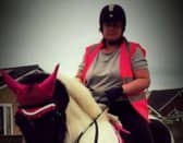 Michelle Hanney pictured riding a horse. (DWP/SWNS)