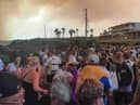 Tourists are evacuated from hotels during a wildfire on the Greek island of Rhodes on July 22, 2023.