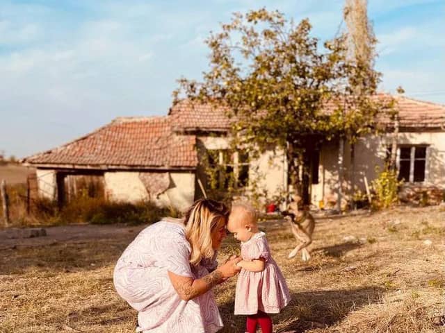 Jordan and Fae Vye outside their farmhouse in Bulgaria.