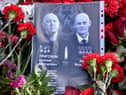Sheet of paper with portraits of Yevgeny Prigozhin and Dmitry Utkin, a shadowy figure who managed Wagner’s operations and allegedly served in Russian military intelligence, is placed at a makeshift memorial in front of the Private Military Company (PMC) Wagner Centre in Saint Petersburg, on August 26.