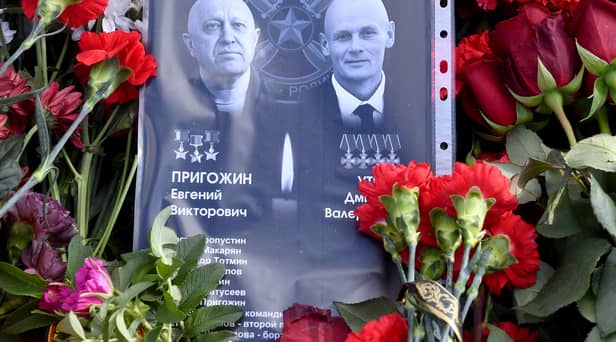 Sheet of paper with portraits of Yevgeny Prigozhin and Dmitry Utkin, a shadowy figure who managed Wagner’s operations and allegedly served in Russian military intelligence, is placed at a makeshift memorial in front of the Private Military Company (PMC) Wagner Centre in Saint Petersburg, on August 26.