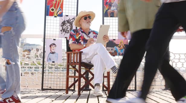 Jim Moir illustrates members of the public at the seaside