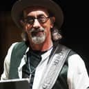 Jack Sonni was known as “the other guitarist” during the London band’s Brothers in Arms era. Source: https://commons.wikimedia.org/