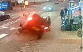CCTV capturing the dramatic moment a mum managed to pull her two-year-old daughter to safety seconds before her pram was crushed underneath a car in a heart-stopping crash (SWNS)