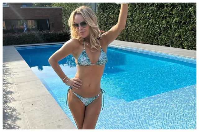 Amanda Holden is making the most of the spring weekend sunshine by enjoying time spent by her pool at her luxury mansion in Surrey.
