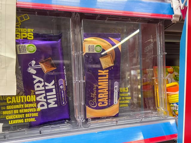 Numerous products are being kept in security boxes at supermarkets - including £2 chocolate bars (Photo: James Linsell Clark/SWNS)