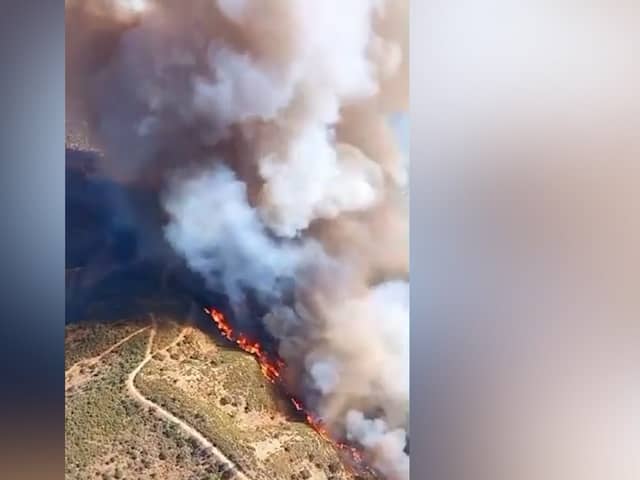 Fire rages between two popular tourist destinations