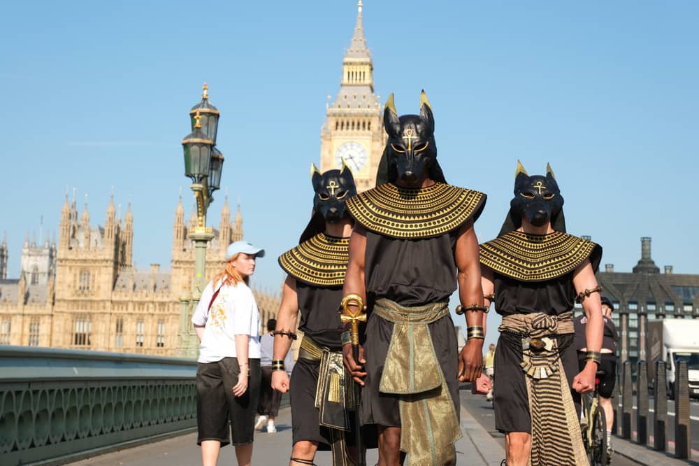 Performers dressed as the ancient Egyptian god Anubis surprise London commuters.