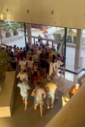 Holidaymakers queue at the doors of the Villa Romana hotel in Salou, Spain at 7.55am, on August 7, before making a chaotic dash for the sunbeds. 