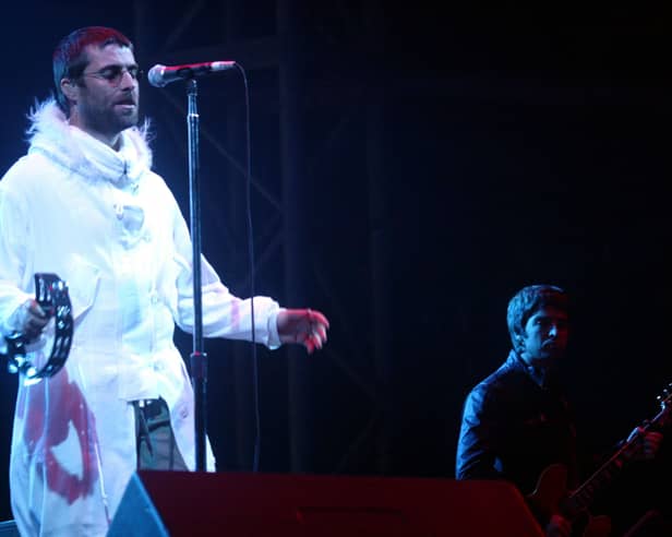 Oasis on the Pyramid Stage at Glastonbury in 2004. Photo: Matt Cardy/Getty Images
