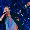 Coldplay have announced huge shows in the UK for their Music Of The Spheres tour. 