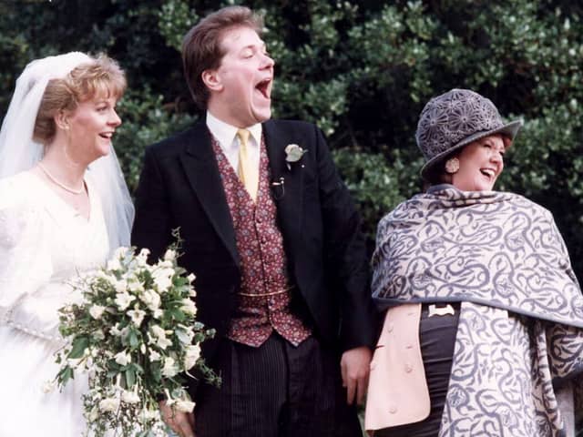 Alex and Sue Tatham on their wedding day with Cilla Black.